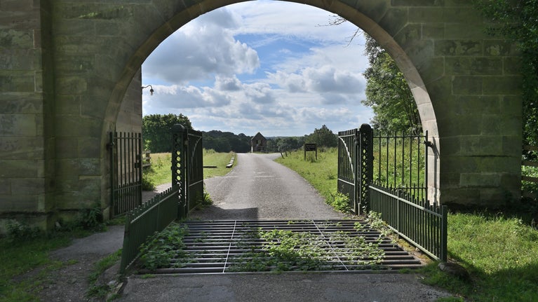 Looking through the archway of Middle Lodge at Calke Abbey, Derbyshire
